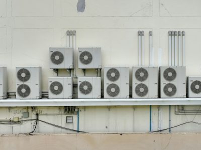 many-condensing-units-of-air-conditioners-are-installed-on-concrete-building-wall-air-conditioner.jpg